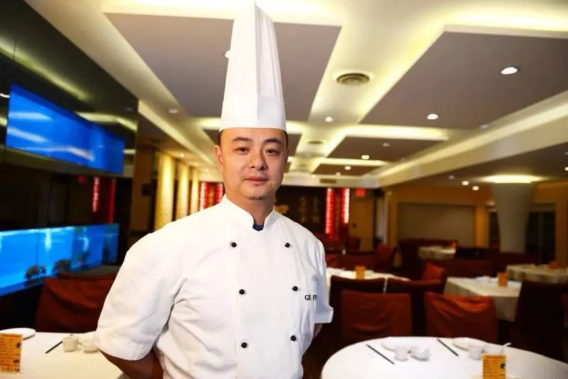 Master Chef Ge Feng in his chef's whites in the Yuan's Garden dining room